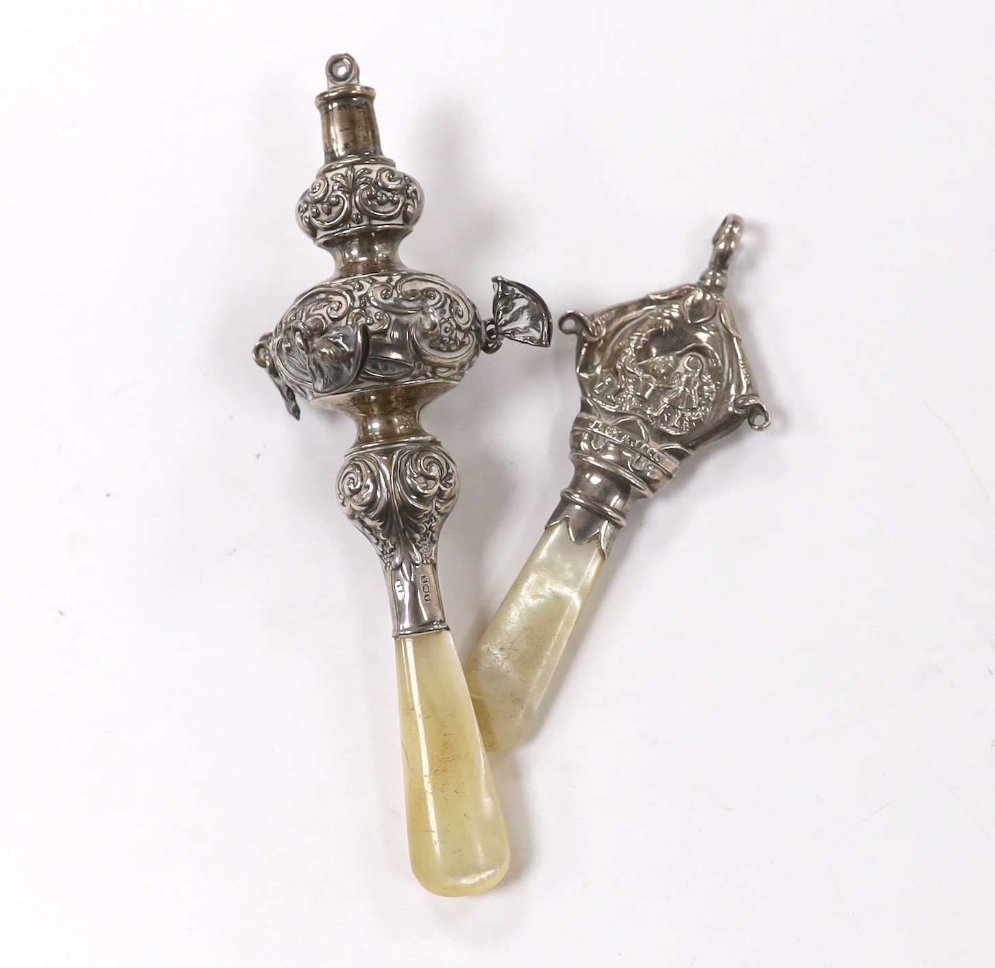 Two George V child's silver rattles, both with mother of pearl teethers, largest 14cm.